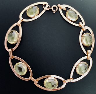 Золотой браслет с хризолитами